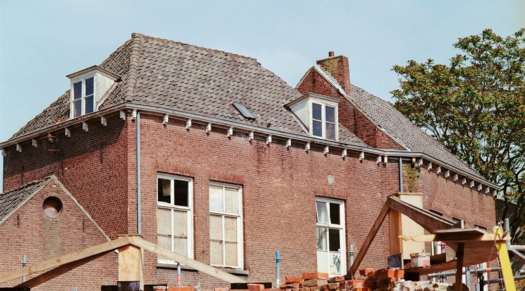 a large brick building with a clock on the front of it